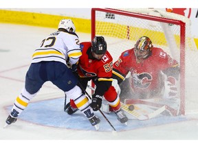 Calgary Flames goalie David Rittich makes a save on a shot by Johan Larsson of the Buffalo Sabres during NHL hockey at the Scotiabank Saddledome in Calgary on Wednesday. Photo by Al Charest/Postmedia.