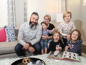 Don and Megan Kliparchuk and their children Dublin, 3, Salem, 4, Payton, 8, and Bella, 6, in Sterling Homes' McKinley show home in Harmony.