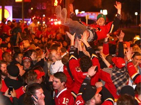 Flames fans crowd the Red Mile along 17th Avenue S.W. during the 2014-15 playoff run.