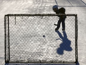 Jonah Bain,4, takes some shots on the outdoor ice at the Rosemont Community Centre as the mild weather is back in Calgary on Monday January 21, 2019.
