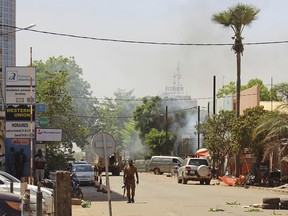A soldier walks near the army headquarters in central Ouagadougou, Burkina Faso after attacks by Islamic extremists in the capital on March 2, 2018. A B.C. mining employee has reportedly been kidnapped in the country.