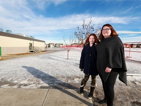 Joylynn Matheson stands with her daughter Isabella near the Copperfield Elementary School field where parents have been fundraising for over two years to get a playground built. Isabella is in grade 4 at the school. The pair were photographed on Thursday January 31, 2019.  Gavin Young/Postmedia