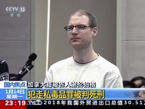 In this image taken from a video footage run by China's CCTV, Canadian Robert Lloyd Schellenberg attends his retrial at the Dalian Intermediate People's Court in Dalian, northeastern China's Liaoning province on Monday, Jan. 14, 2019.