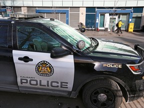 A police vehicle was photographed parked across the street from the safe consumption site at the Sheldon Chumir Centre in the Beltline on Tuesday Jan. 29, 2019.