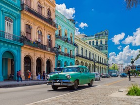 File photo - A classic car drives through Havana.