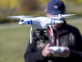 A DJI Phantom II drone flies recreationally in a rural area near Calgary on Sept. 22, 2015.