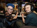 Brothers LR, Alexander, 11, and Jonathan, 13, Howe were in their element during the inaugural Calgary eSports League event at Telus Spark in Calgary