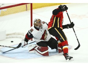 Calgary Flames center Mark Jankowski, right, scores a short-handed goal against Arizona Coyotes goaltender Antti Raanta (32) during the third period of an NHL hockey game Sunday, Nov. 25, 2018, in Glendale, Ariz. The Flames defeated the Coyotes 6-1.