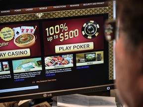 A journalist looks at a gambling web site. Alberta Gaming Liquor Cannabis is seeking bids for a contractor to set up an online gambling presence.