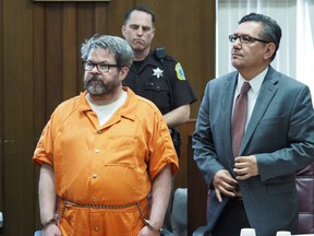 In this April 20, 2017 file photo, defendant Jason Dalton, left, who is charged with killing six people in-between picking up riders for Uber, stands with attorney Eusebio Solis during a hearing in Kalamazoo, Mich.