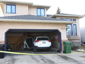 Police investigate a suspected homicide in a home on Edgepark Way N.W. in Calgary on Jan. 10, 2018.