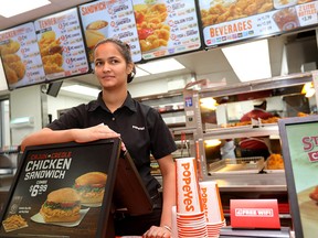 Gurjot Kaur, shift manager of Popeyes, is concerned with the rising taxes along  17th Avenue S.W.