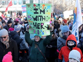 Marchers made signs before taking part in the third annual Women's March in Calgary.