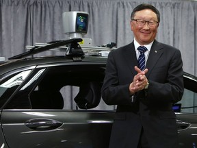 John Chen at the Ottawa announcement Friday with a Lincoln vehicle equipped with BlackBerry's QNX software.