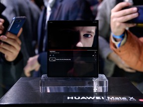 Visitors take images of Huawei's new foldable 5G smartphone HUAWEI Mate X at the Mobile World Congress (MWC), on the eve of the world's biggest mobile fair, on February 24, 2019 in Barcelona. - Phone makers will focus on foldable screens and the introduction of blazing fast 5G wireless networks at the world's biggest mobile fair starting tomorrow in Spain as they try to reverse a decline in sales of smartphones. (Photo by Josep LAGO / AFP)JOSEP LAGO/AFP/Getty Images