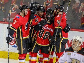 Calgary Flames Andrew Mangiapane celebrates with teammates after scoring against the Anaheim Ducks in NHL hockey at the Scotiabank Saddledome in Calgary on Friday, February 22, 2019. Al Charest/Postmedia