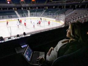 Postmedia sports reporter Kristen Anderson watches Calgary Flames practice at the Saddledome in Calgary, on Thursday Dec. 6, 2018.
