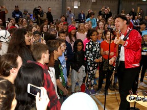 The band Arkells pays a surprise visit to Calgary Arts Academy on Wednesday. The students are winners of the MusiCounts Passion Prize with a cover of the Arkells hit People's Champ.