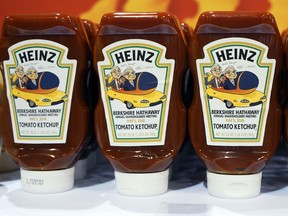 Bottles of Heinz tomato ketchup bear a special Berkshire Hathaway label as they are offered for sale to shareholders on the exhibit floor at the CenturyLink Center in Omaha, Neb., Friday, May 4, 2018, where Berkshire brands display their products and services.