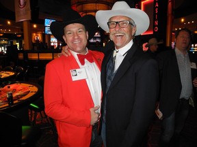 The 14th annual Flames Ambassadors Celebrity Poker Tournament held Feb. 5 at Cowboys Casino raised more than $365,000 for the Calgary Flames Foundation, bringing the total raised through the poker event to more than $5 million in 14 years. Pictured are tournament co-chairs Steve Major (left) and Rollie Cyr.