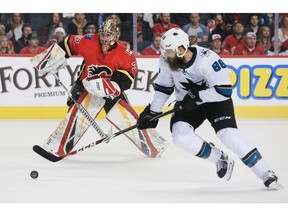 The San Jose Sharks' Brent Burns goes around Calgary Flames goaltender David Rittich to score during NHL action at the Scotiabank Saddledome in Calgary on Thursday February 7, 2019.  Gavin Young/Postmedia