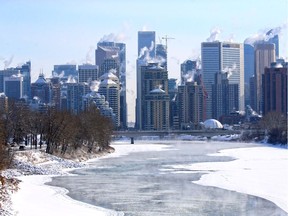 Steam rises from downtown buildings and the Bow River in Calgary, on Monday Feb. 11, 2019.