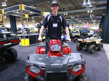Tyler Wendlandt checks out a quad at the Calgary Boat and Outdoors Show at the BMO Centre on Thursday February 7, 2019. The show continues through the weekend.