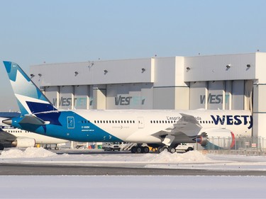 Westjet's first Boeing 787 Dreamliner was opened up for media in Calgary to take a look at the interior on Thursday February 14, 2019. The Dreamliner is too large for the company's current hangers and so just the front of the plane was moved into the hanger. A new larger hanger is set to complete construction at the end of March.