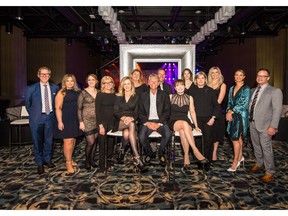 Pictured, from left, at the Big Ball Feb. 1 at Hotel Arts are volunteer ball committee members Fraser Abbott; Caroline Seymour,; Ashley Wilford-Matthews; Eva Moreau; ball ambassador Karen Gosbee; Alison Carter; ball honorary chair and Prostate Cancer Centre (PCC) board member Bill Brooks; Mark Wilson; ball chair and PCC board member Dr. Shelley Spaner; Isla Gosbee; PCC executive director Pam Heard; Shannon de Vall; Lana Rogers and Brian Brownlee. Committee members not pictured were Dustin Westling and Shea Kerwood. The ball raised more than $100,000 for men's mental health at the Men's Health Clinic at the Prostate Cancer Centre. Photo: Brian Buchsdruecker