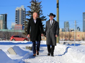 Michael Brown, President and CEO with the Calgary Municipal Land Corporation (CMLC) walks with Warren Connell, CEO with the Calgary Stampede in areas at the Stampede slated for major development. CMLC and the Calgary Stampede announced they were partnering on the development on Thursday February 21, 2019. Gavin Young/Postmedia