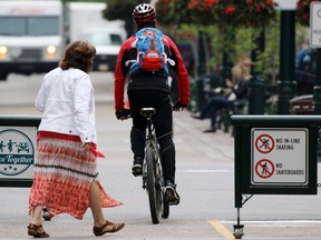 A cyclist uses the Stephen Avenue Mall designated cycle track on Thursday June 18, 2015.