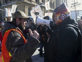 For and against oil protesters discuss their positions during demonstrations in Ottawa, Tuesday February 19, 2019.