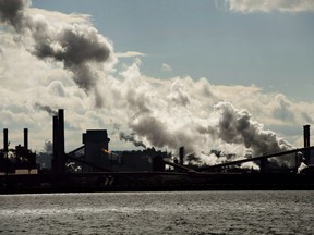 The steel mills in the Hamilton waterfront harbour are shown in Hamilton, Ont., on Tuesday, October 23, 2018. A large proportion of small- and medium-sized businesses soon to be subjected to Ottawa's carbon tax worry they'll be unable to pass along the bulk of the extra costs to their customers, suggests a new survey being released Tuesday.