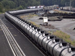 A northbound oil train sits idled on tracks, stopped by protesters blocking the track ahead, in Everett, Wash., on September 2, 2014. The National Energy Board says crude-by-rail exports from Canada reached a new record high in December.