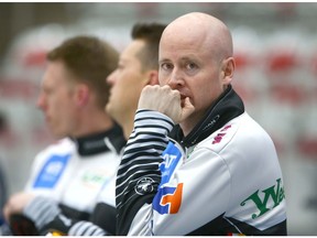 Kevin Koe pauses with teammates during warm up at the Pinty's Grand Slam of Curling Humpty's Champions Cup event at WInSport in Calgary on Tuesday, April 24, 2018. Jim Wells/Postmedia