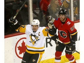 Pittsburgh Penguins, Sidney Crosby scores on Calgary Flames goalie, Mike Smith in first period action at the Scotiabank Saddledome in Calgary on Thursday October 25, 2018. Darren Makowichuk/Postmedia