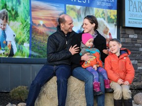 Guillaume Morin and Kelsey Chegus with their two children, Luca, 7, and Skye, 2, look forward to their new home at Arrive in Crestmont, by Partners Development Group in Crestmont West.