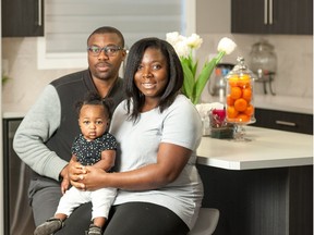 Tola Azeez, her husband Olusoji Mafimisebi, and their daughter, Lois, in their new home at Cornerstone Townhomes by Jayman Built.