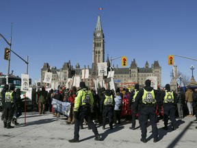 Hundreds of Pro-pipeline supporters arrived in a convoy from Alberta and other parts of the country in to protest against the Liberal government on Parliament Hill in Ottawa Tuesday Feb 19, 2019. Anti-pipeline supporters screaming at the Pro-pipeline supporters.