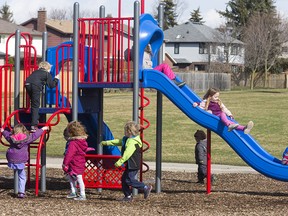 Children in a playground in London, Ont., on March 17, 2016. Statistics Canada says there has been a decline in the poverty rates for children in Canada and is drawing a connection to the Liberal government's signature child benefit.