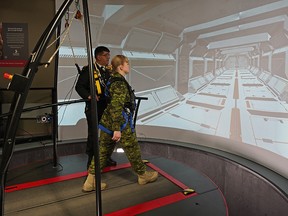 Col. Rakesh Jetly (chief pyschiatrist, Canadian Armed Forces) demonstrates the 3MDR system with Capt. Anna Harpe at Glenrose Rehabilitation Hospital in Edmonton on Wednesday February 13, 2019. HiMARC’s Motion-Assisted Multi-Modal Memory Desensitization and Reconsolodation (3MDR) uses virtual reality to treat post traumatic stress syndrome (PTSD). (PHOTO BY LARRY WONG/POSTMEDIA)