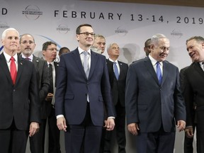 FILE - In this Thursday, Feb. 14, 2019 file photo, United States Vice President Mike Pence, Prime Minister of Poland Mateusz Morawiecki, Israeli Prime Minister Benjamin Netanyahu and United State Secretary of State Mike Pompeo, from left, stand on a podium at a conference on Peace and Security in the Middle East in Warsaw, Poland. A two-day security conference in Warsaw was supposed to be a crowning achievement for Israeli Prime Minister Benjamin Netanyahu, stamping a seal on his long-held goal of pushing his behind-the-scenes ties with Arab leaders into the open. Instead, the publicity-seeking Israeli leader made one embarrassing misstep after another, distracting attention from his main mission and sending his aides into a nonstop cycle of damage control.