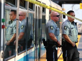 Calgary Police and Calgary Transit officers hold a scene at the Rundle Station in northeast Calgary on Tuesday July 18, 2017. Jim WellsPostmedia