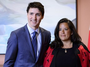 Prime Minister Justin Trudeau and Veterans Affairs Minister Jodie Wilson-Raybould attend a swearing in ceremony at Rideau Hall in Ottawa on Monday, Jan. 14, 2019. The Globe and Mail says former justice minister Jody Wilson-Raybould disappointed the Prime Minister's Office by refusing to help SNC-Lavalin avoid a criminal prosecution.