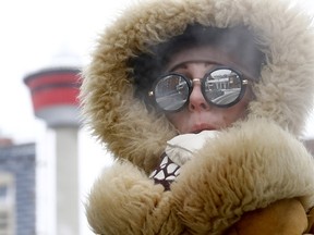 Jamie Tognazzini does her best to keep warm as the deep freeze hits Calgary on Sunday, Feb. 3, 2019.