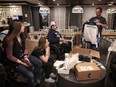 Humboldt Broncos' Ryan Straschnitzki and family look through gifts in the lobby of the hotel  they have been living at for six months in Airdrie on Wednesday December 19, 2018. Leah Hennel/Postmedia