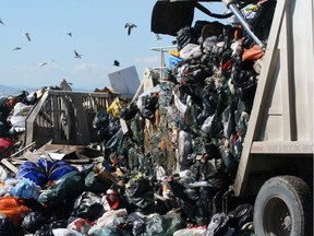 TRASH -  Unloading the truck at the tip on the edge of one of the sections of the East Calgary Landfill.n/a ORG XMIT: garbageone220