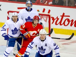 Calgary Flameslooks to redirect a puck past goalie Frederik Andersen of the Toronto Maple Leafs during NHL hockey at the Scotiabank Saddledome in Calgary on Monday, March 4, 2019. Al Charest / Postmedia