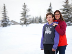 Tamara Keller with her 13-year-old son Landon near the location of the proposed north high school. With uncertainty around capital funding, the new north high school remains stuck in the planning stage and has parents in the area worried where their kids will go to high school.