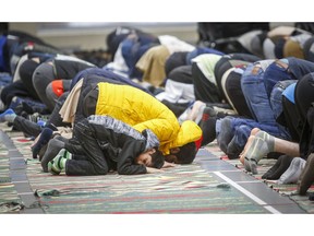 Worshippers attend a memorial service at the Al Madinah Islamic Centre in Calgary, Alta., Friday, March 15, 2019, for the victims of the mosque shootings that occurred in New Zealand.